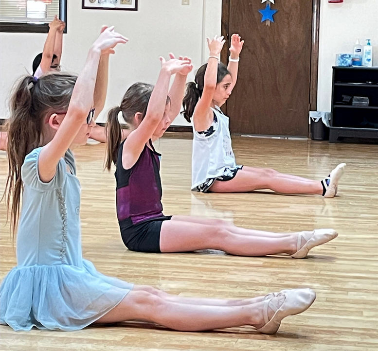 dancers stretching for ballet class at Dance Creations Inc. dance studio
