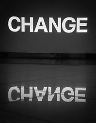The word change illuminated in white and