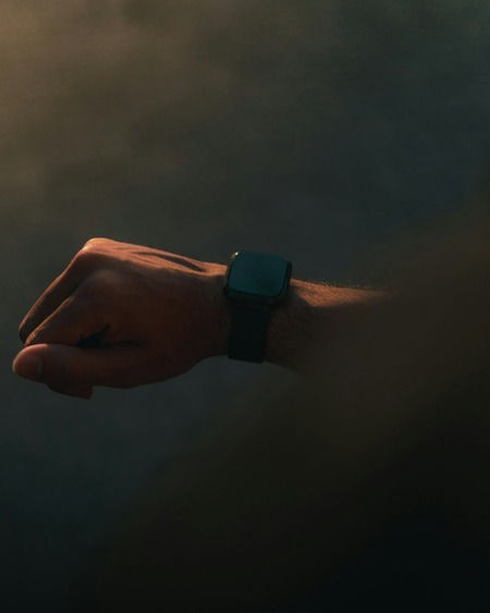 Hand holding supplement pills