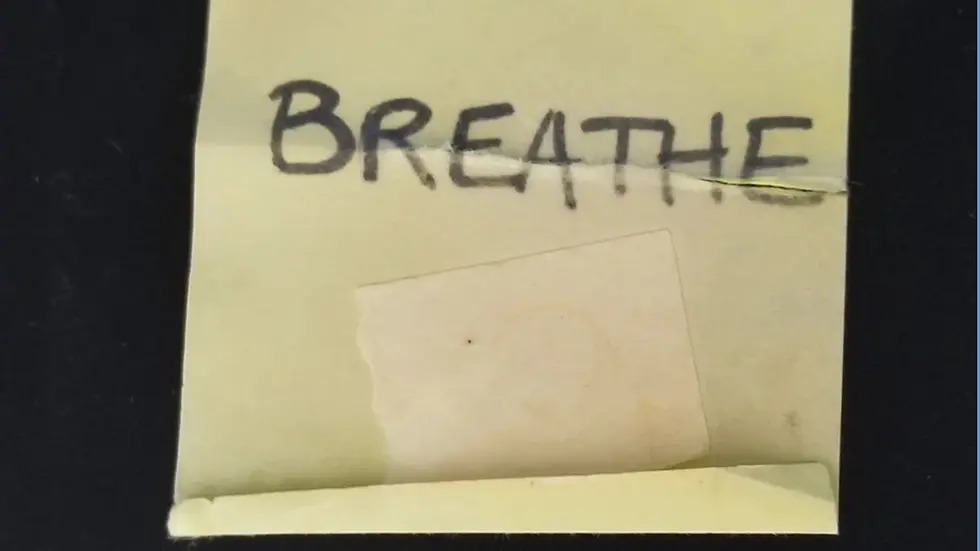 Sticky note with word "Breathe"