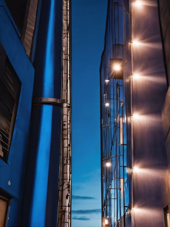 vertical image of an Industrial building with outdoor lighting.jpg
