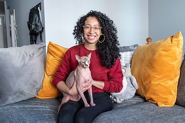 woman sitting with her cat while posing for pet photography session in chicago pet photographer in chicago photographed by pamela l king photography