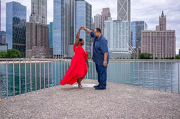 man and woman dancing at Milton lee olive park while taking engagement photos photographed by Pamela l king photography