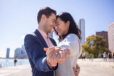 engagement photographer in chicago couple posing for engagement photos at north avenue beach in chicago photographed by Pamela l king photography