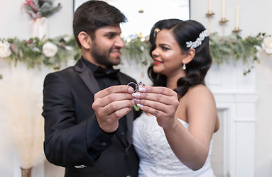 chicago wedding photographer Illinois wedding photographer bride and groom posing for photos with their rings after their wedding ceremony photographed by pamela l king photography