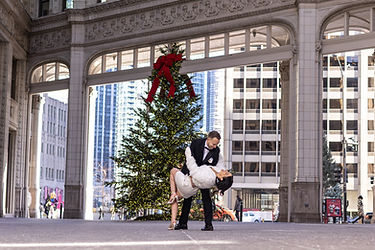 couple posing at the wrigley building in chicago photographed by pamela l king photography