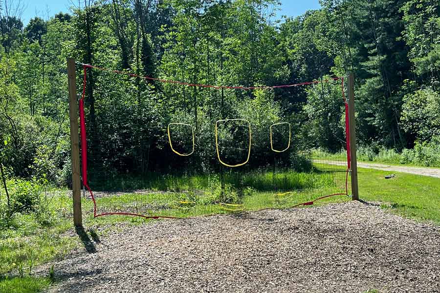 Disc golf practice net with hanging rope targets at Punderson State Park.