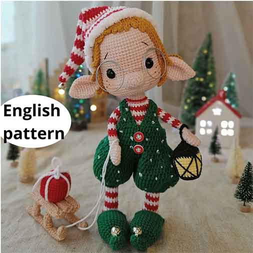 Adorable crochet elf boy and girl in festive outfits, crafted using detailed Elf crochet patterns.