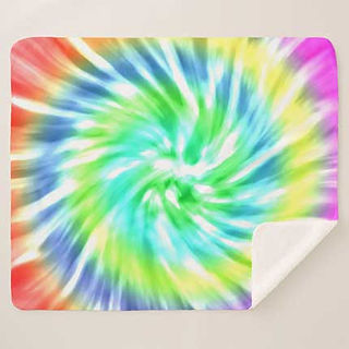 Sherpa fleece blanket featuring a spiral tie-dye design with blended rainbow colors radiating outward.