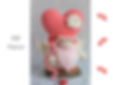 Valentine's Day gnome cupid crochet pattern featuring a heart-shaped body and pink details