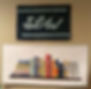 Modern bookcase quilt pattern displayed below a 'Sew' sign, featuring colorful fabric books on a light background.