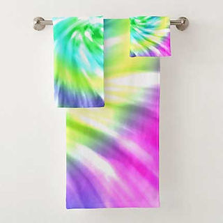 Bathroom towel set featuring a soft spiral tie-dye pattern with blended rainbow colors.
