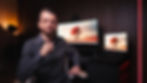 German Spokesperson Tobias Schendel in the Modern Home Office set for BlackForest Media. Image highlights a professional presenter with customized monitors and atmospheric lighting.