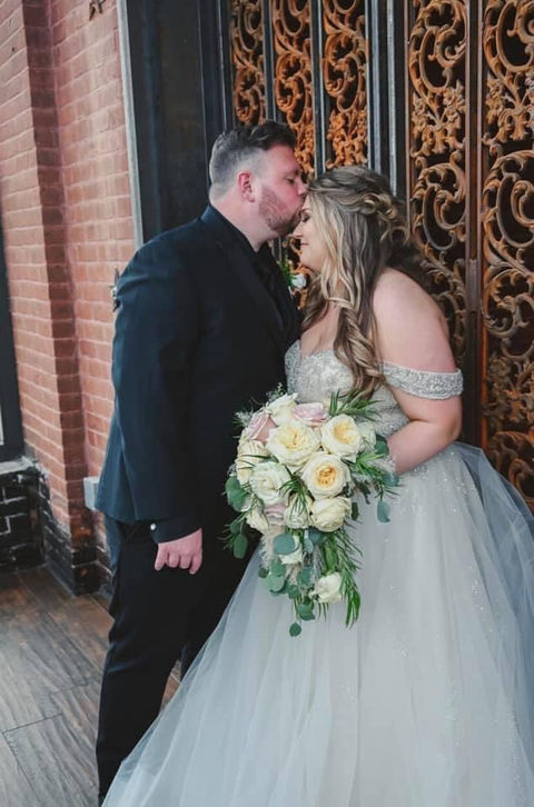bride and groom pink cascade.jpg