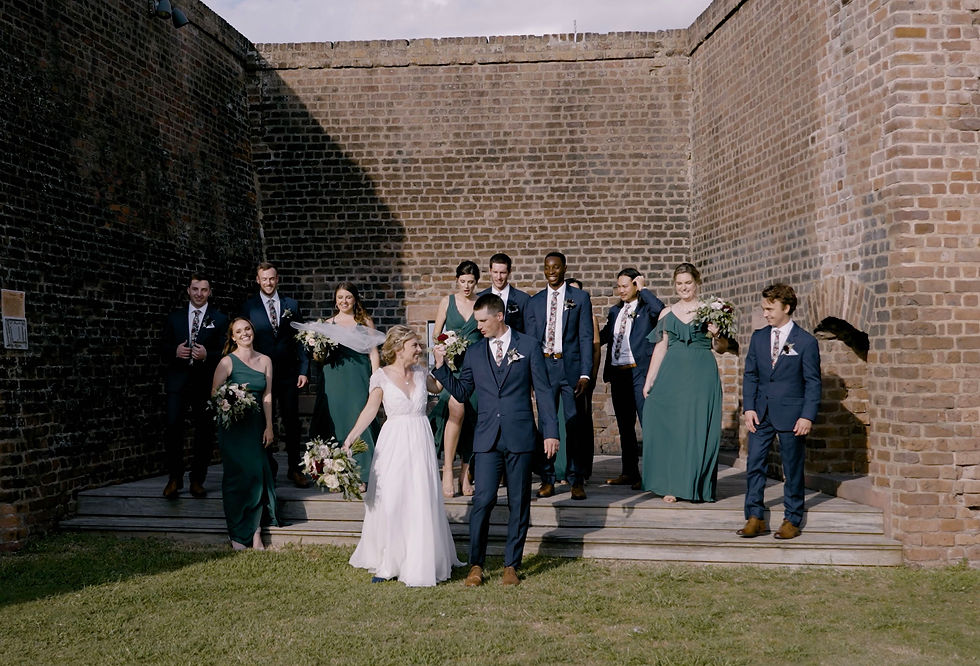 Wedding photography and videography example of a wedding party celebrating together at a Savannah wedding ceremony venue called old fort jackson.