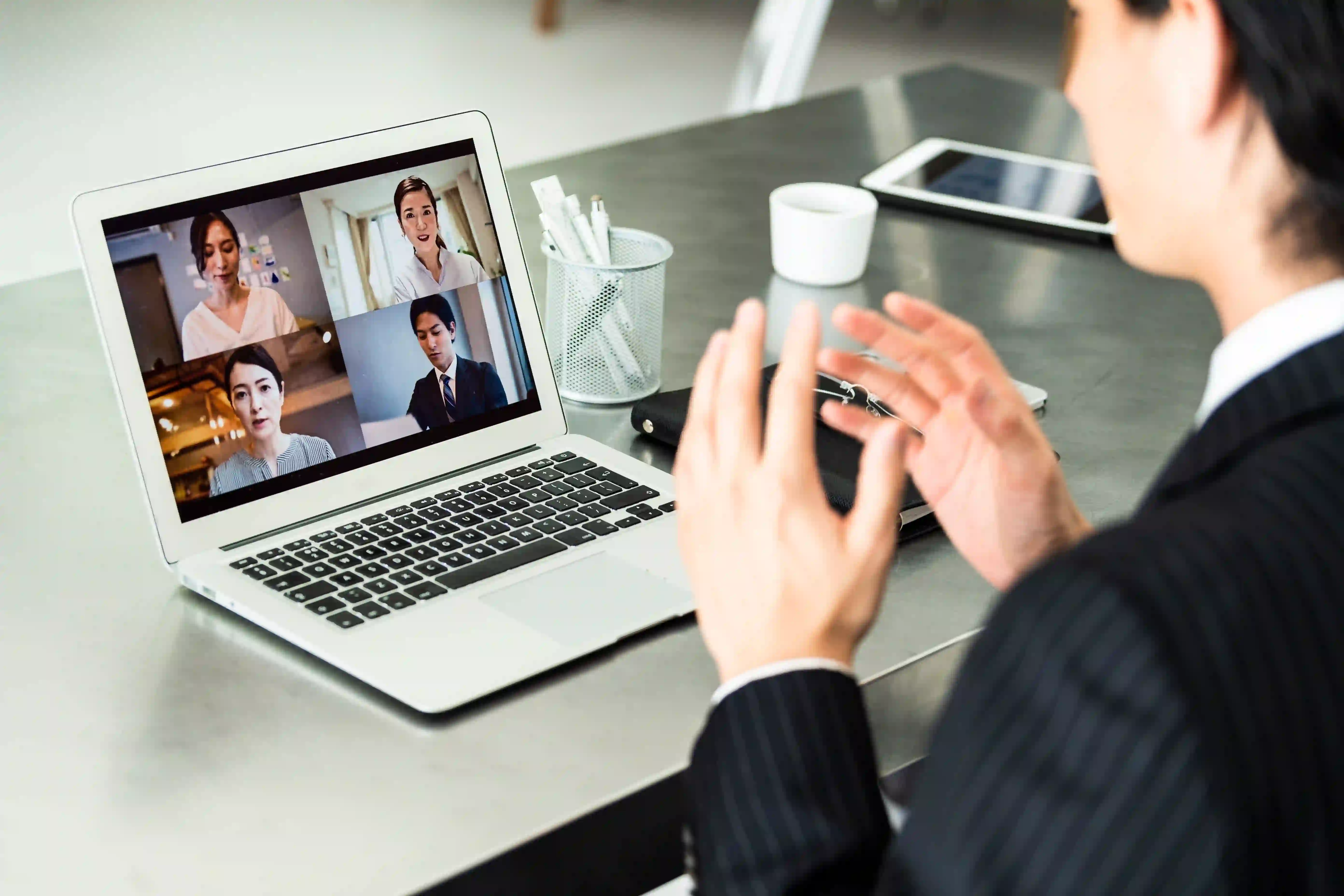 Man presenting during a virtual meeting.webp