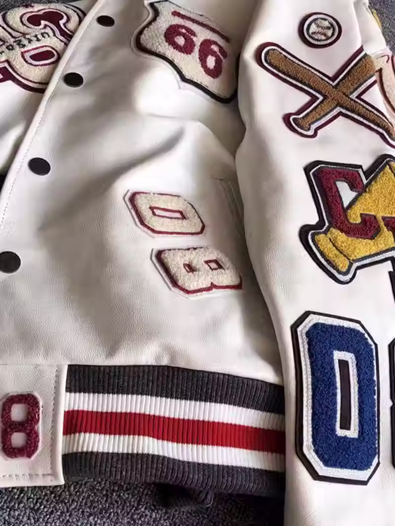 Thumbnail: Varsity baseball bomber jacket featuring detailed embroidered patches, bol
