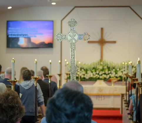 Worship at St. Matthew's Episcopal Church in Sterling, VA. Carrying cross down aisle before service begins