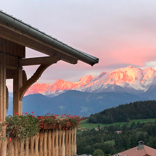 Pink Mont Blanc summit seen from the balcony of a chalet in Cordon