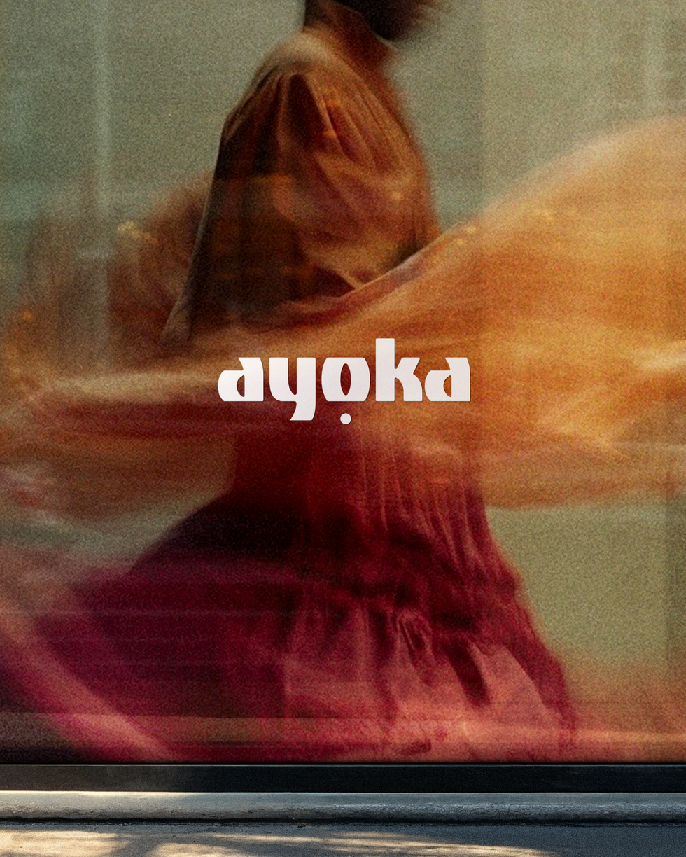 Editorial fashion art direction for Ayoka by Atin, featuring an 'ayoka' logo overlay on dynamic, motion-blur textile photography.