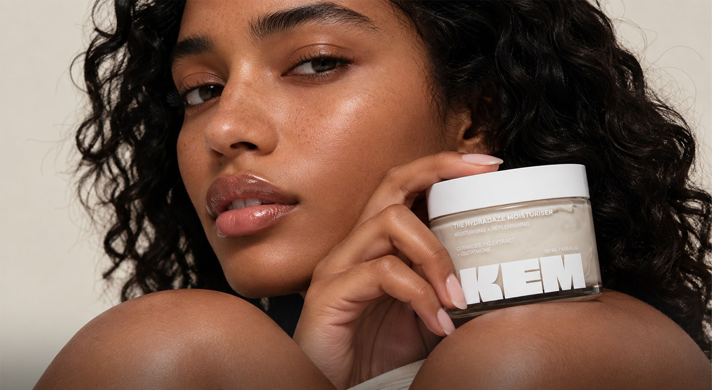 Editorial beauty photography of a model holding Kem moisturiser packaging, campaign art direction by Atin, strategic branding agency London.