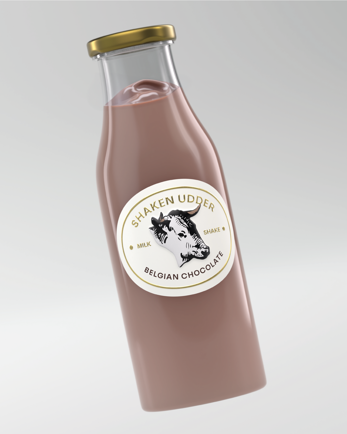 High-end studio product photography for Shaken Udder by Atin, showcasing the sleek sustainable glass bottle and elevated brand identity.