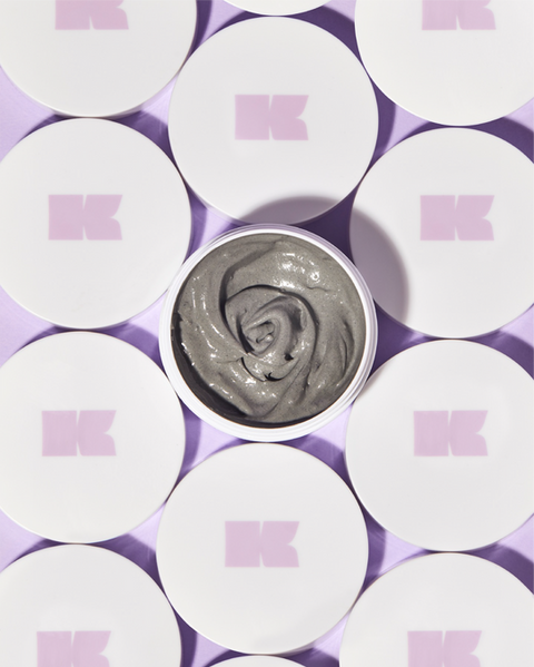 Bespoke packaging design for Kem beauty by Atin, featuring a macro detail of white product lids with a pink K monogram to elevate shelf presence.