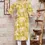 Thumbnail: Back view of women’s yellow floral printed cotton kurti – straight fit design