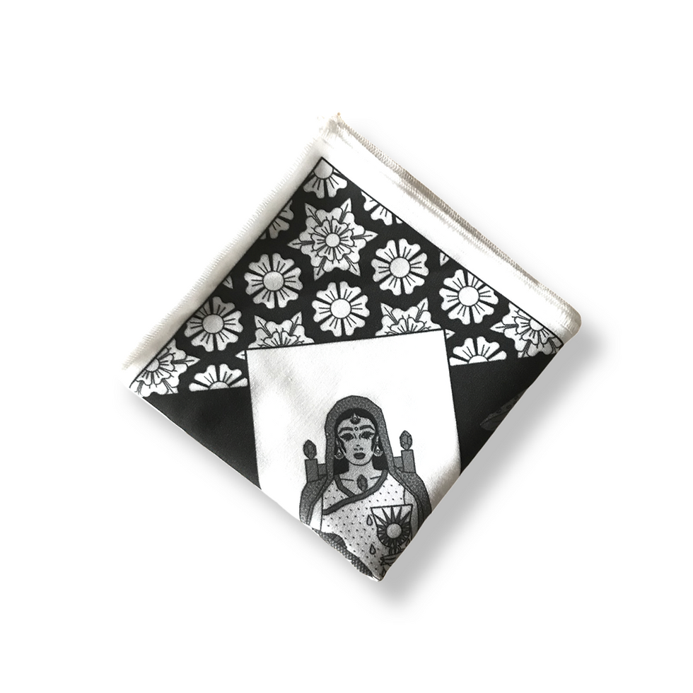 Thumbnail: An image of a folded white cloth with a black graphic pattern printed on it