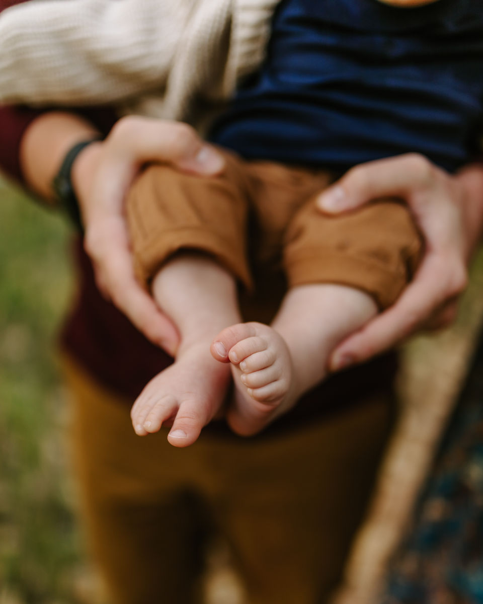 Outdoor family photography session in Fort Collins, Colorado with parents and children at natural outdoor location.