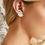 Thumbnail: White And Gold Geometric Stud Earrings