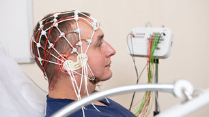 Saccadic impairment in chronic traumatic brain injury: examining the influence of cognitive load and injury severity