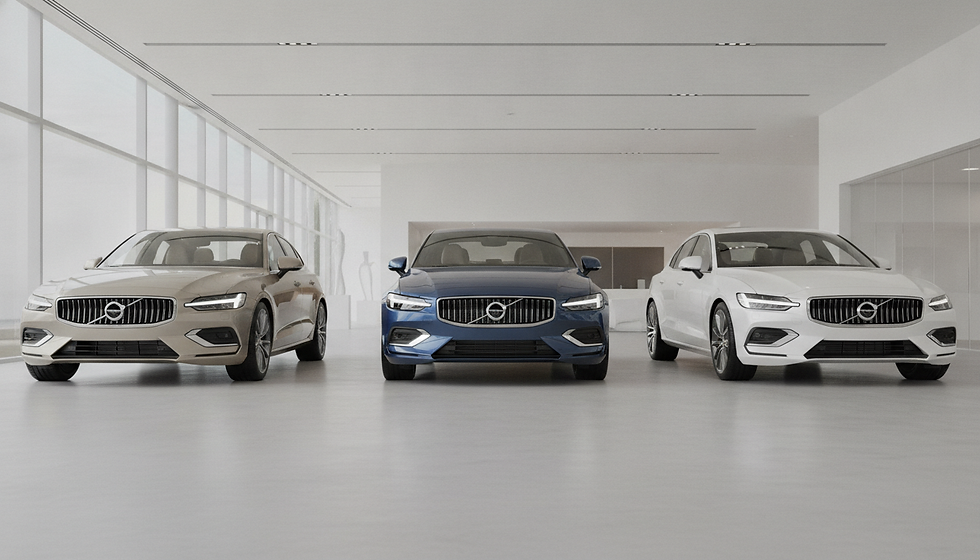 Three Volvo sedans—beige, blue, and white—sit in a bright minimalist showroom, front-facing and polished.