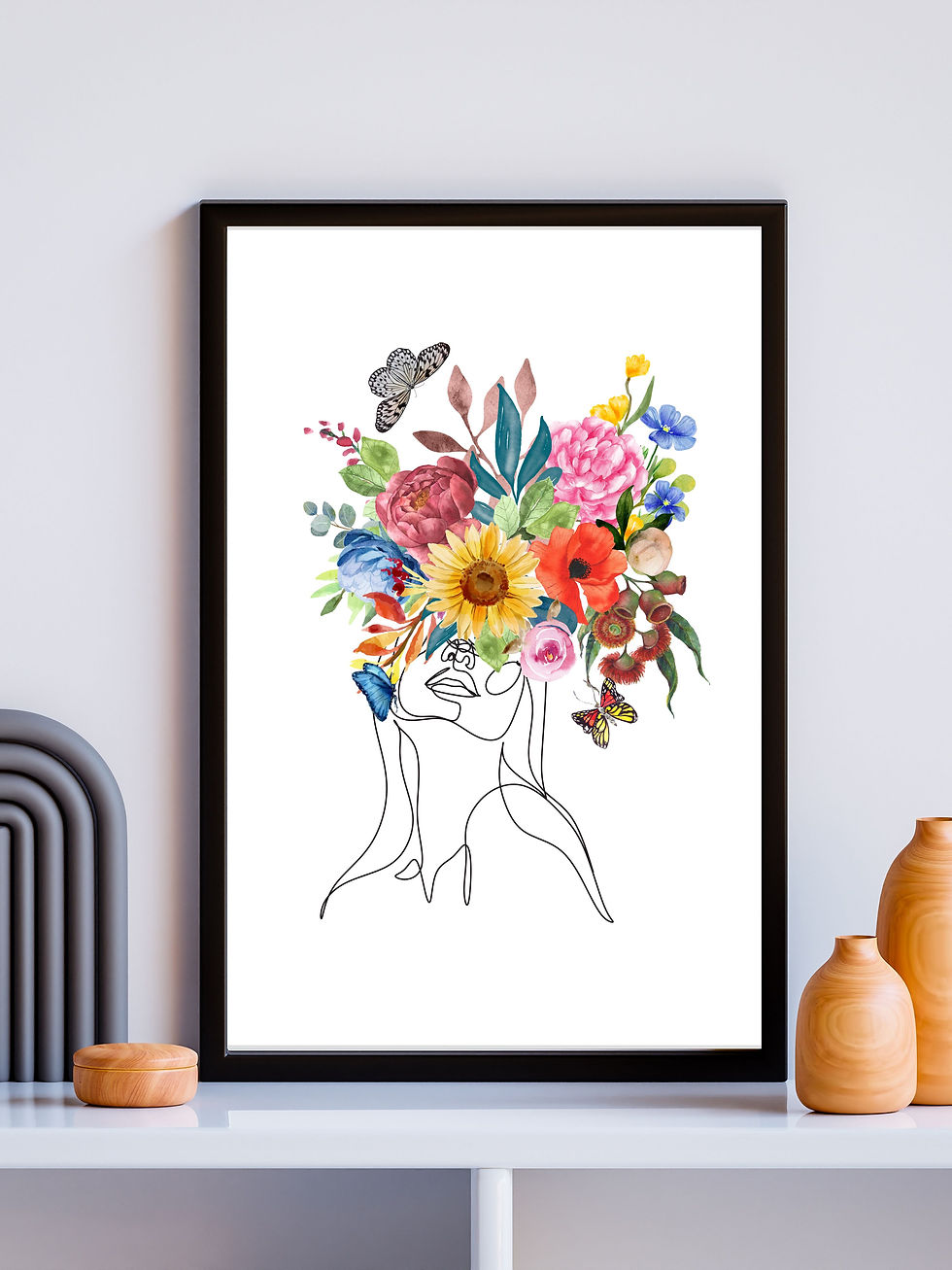 woman line art with flower head framed on console table