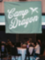 Camp Dragon banner hanging above guests at a past event