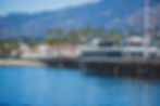 View of Stearns wharf pier of Santa Barbara with Santa Ynez mountains and Pacific Ocean, S