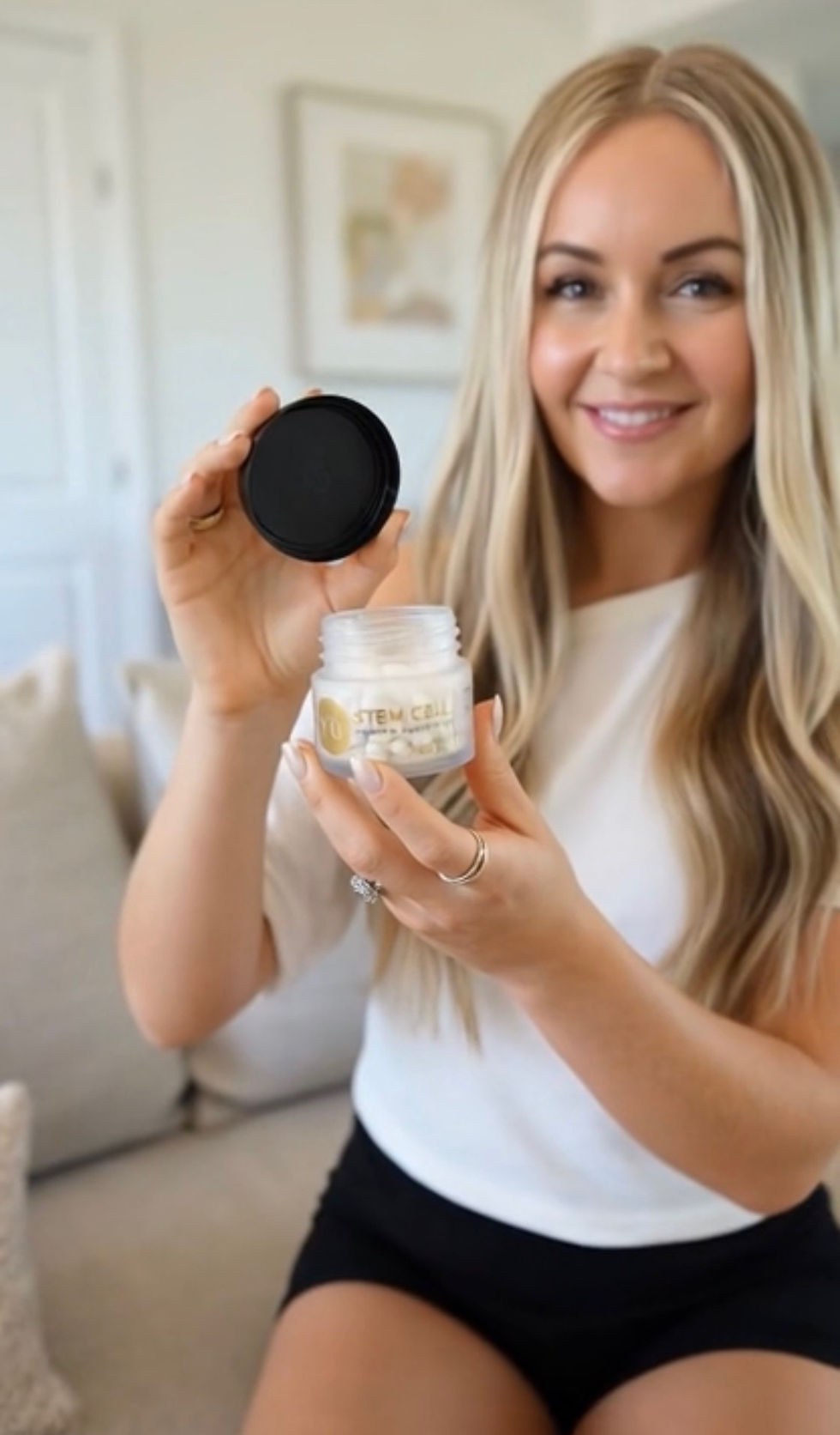 Holding stem cell supplement capsules while testing a plant-based cellular health product