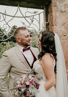 WEDDING COUPLE AT A WALLED GARDEN GATE IN SCOTLAND