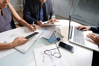 business-people-sitting-office-desk-working-project_edited.jpg