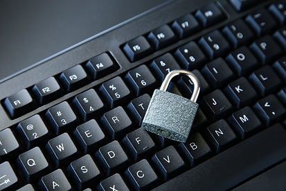 high-angle-shot-lock-black-computer-keyboard-black-surface.jpg