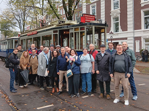 Light Rail Professionals Gather in Amsterdam in front of a Tram following the urban tram forum meeting