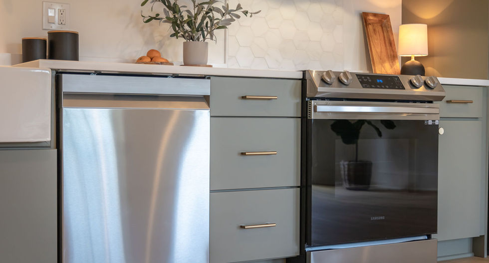 Arrow Works renovation of basement with full kitchen space with dishwasher and stove oven.