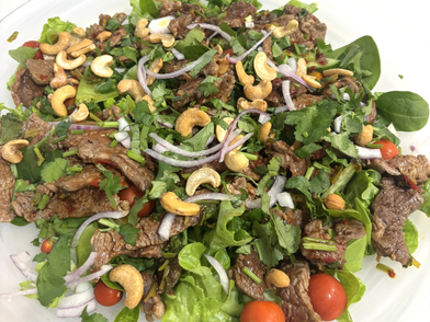 A little different in preparation to your normal Thai Beef Salad, this recipe marinates the cooked beef slices in a spicy, sweet-sour Thai sauce—which then doubles as the salad dressing. Super simple, using only store-cupboard staples and fresh herbs, you can whip this up in no time.