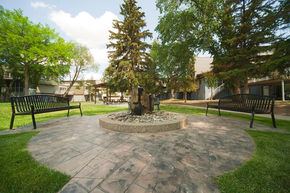 Courtyard with playground and green space at Hillcrest Place.