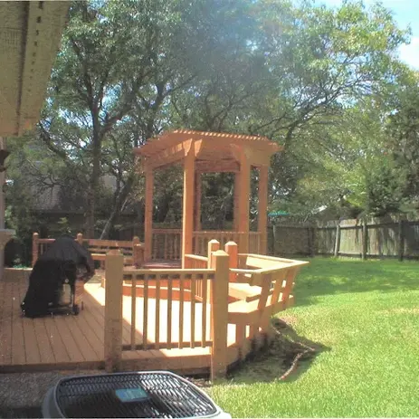 a deck shaded with the sunset
