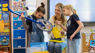 ISB students are working with a teacher