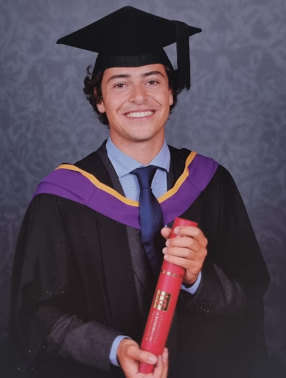 An ISB students with his university diploma in hand