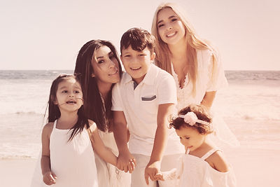 family beach photos in la, in the style of uhd image, dark white and light beige, feminine empowerment, impasto frenzy, hispanicore,