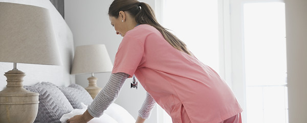 Home Nurse Making Bed