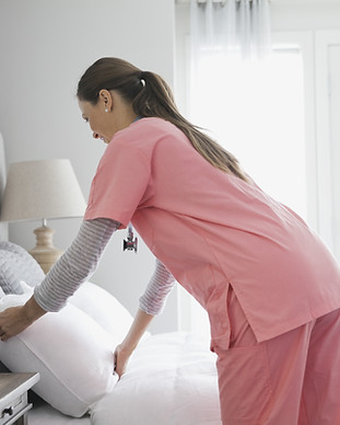 Home Nurse Making Bed
